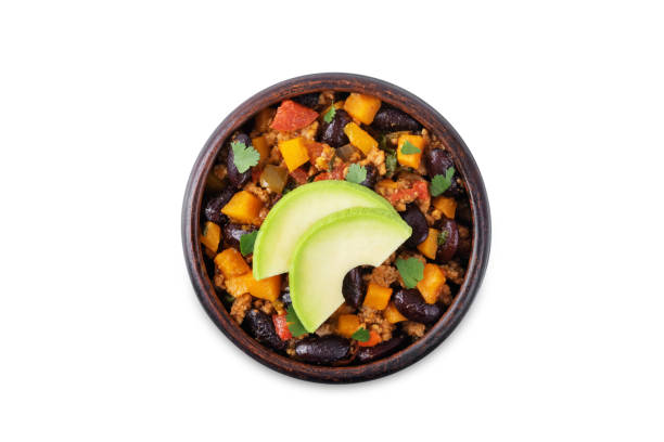 Pumpkin Chili con carne in a bowl on a white isolated background