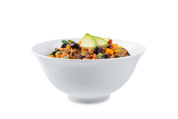 Pumpkin Chili con carne in a bowl on a white isolated background