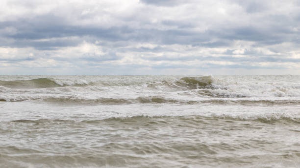 istock Adriatic sea shore under cloudy sky, waves and water splashes 1717253428