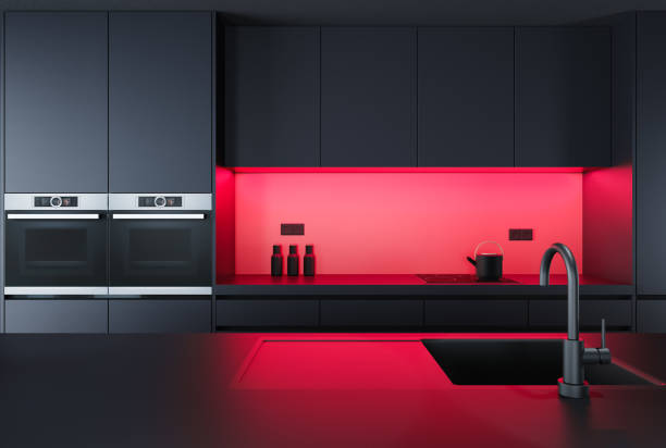istock Black Modern minimalist kitchen with long island with stools. Dark materials. Red details. 1717317707