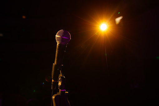 microphone on the empty stage with spotlights  for design purpose