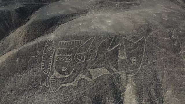 Close up view of the whale know as La Orca part of the Nazca Lines geoglyphs made in the soil of the Nazca Desert Aerial video