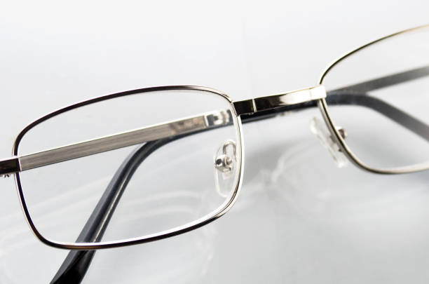 istock Glasses with metal frames on a white background 1717359658