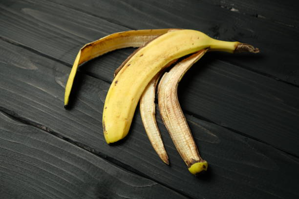 istock banana peel on a dark wooden background 1717365337
