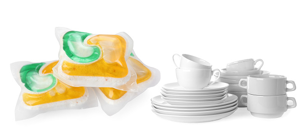 Dishwasher pods and clean tableware isolated on white, collage design