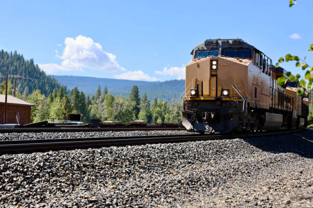 istock Freight train coming down the tracks on a sunny morning 1717404504