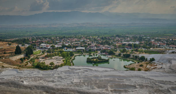 Pamukkale, Denizli Turkey, Travertines of Pamukkale, a Natural thermal pools Pamukkale, Denizli Turkey, Travertines of Pamukkale, a Natural thermal pools surrounded by white limestone, accessed by a walk over rough rocks. natural pools and limestone terraces at ancient hierapolis pamukkale turkey stock pictures, royalty-free photos & images