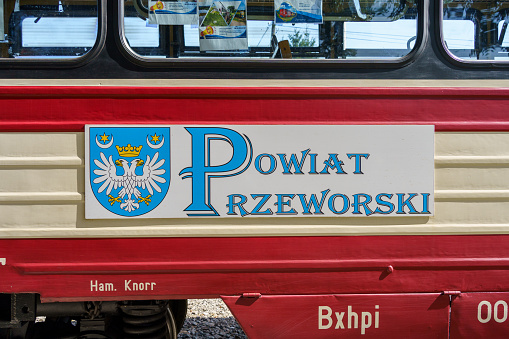 Dynów, Subcarpathian, Poland - 10 September 2023:  coat of arms of Przeworsk Poviat on a wagon of the Przeworsk narrow-gauge railway