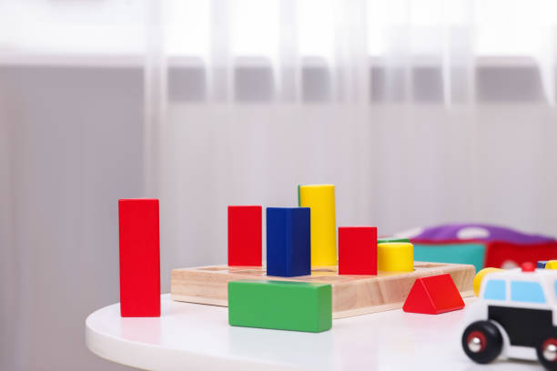 istock Different toys on white table in kindergarten, closeup 1717415674