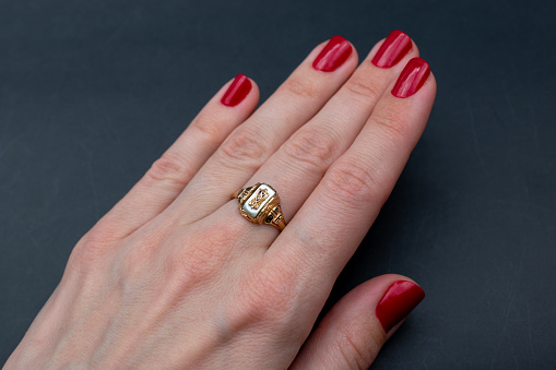 A stunning vintage-inspired ring adorned with vibrant gemstone crystals, showcasing the timeless beauty of colorful gems in a captivating promotional photo.