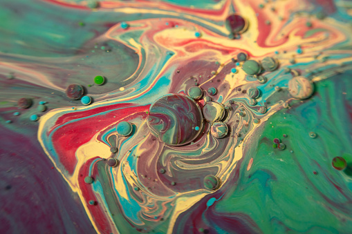 Droplet colors under and over oil, colorful abstract background
