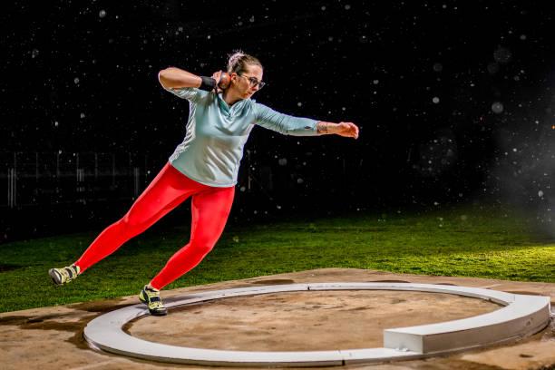 istock Female athlete throwing shot put 1717437829