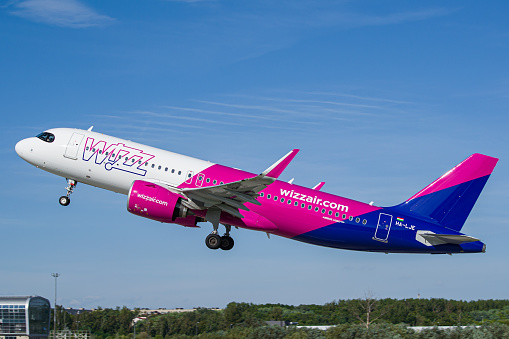 WizzAir Airbus A320 NEO aircraft taking off from Lviv international Airport in sunny weather