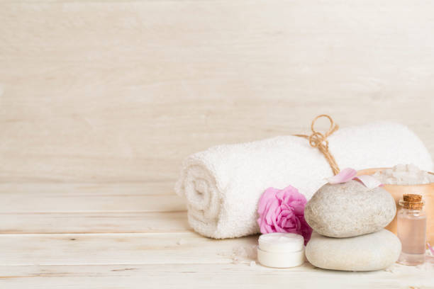 istock Spa composition with pink roses on wooden table 1717446662