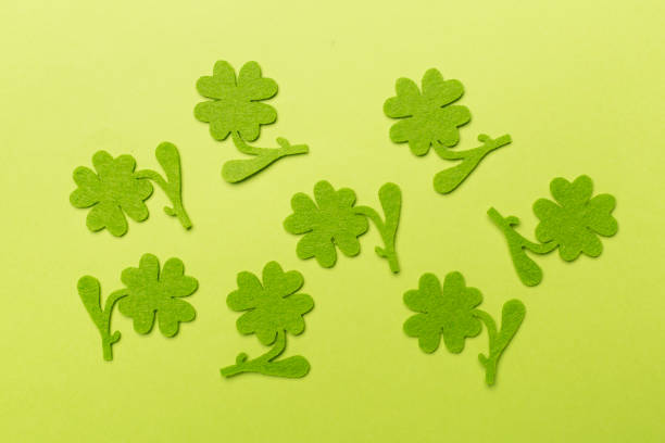 istock Felt clover on color background, top view. St. Patricks day concept 1717465588
