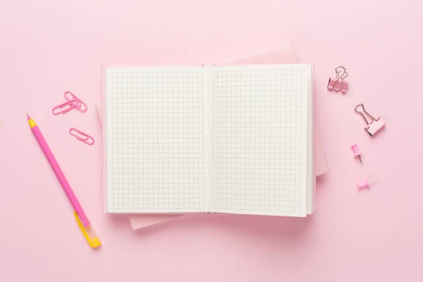 istock Open notebook with stationery on color background, top view 1717465625