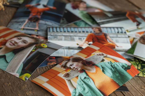 istock Printed photos on table. Photo printing concept. 1717489501