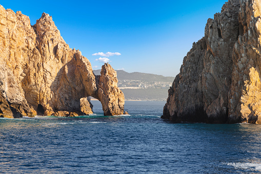 The El Arco Arch at the Land's End rock formations on the Baja Peninsula, at Cabo San Lucas, Mexico.  The arch of Cabo San Lucas is a distinctive granitic rock formation at the southern tip of Cabo San Lucas, which is itself the extreme southern end of Mexico's Baja California Peninsula. The arch is locally known as 