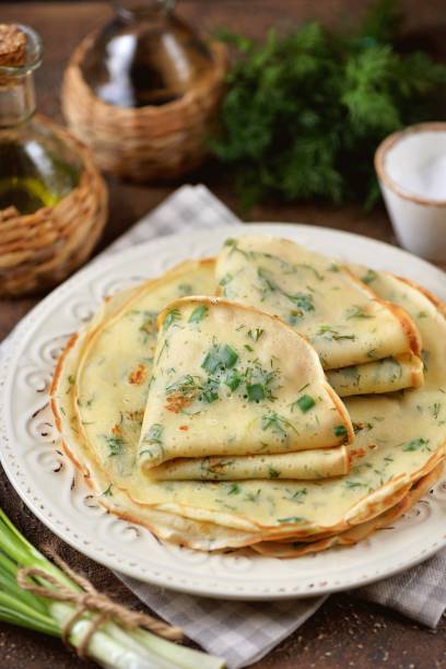 istock Pancakes with green onions and dill. 1717526962