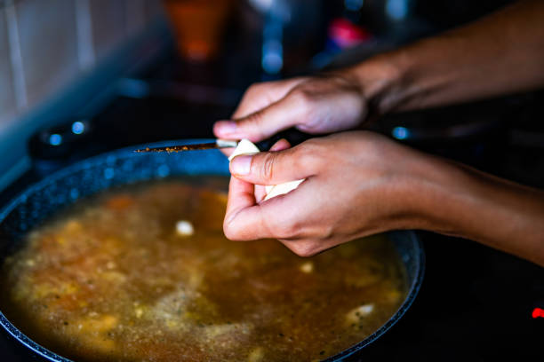 istock A person is smashing garlic 1717547095