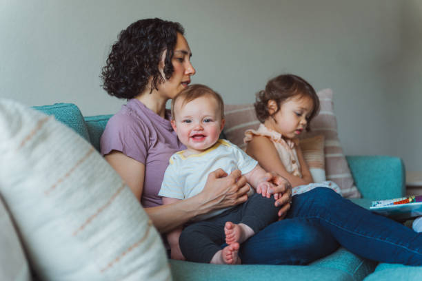 istock Mom and two kids spending time together at home 1717574426