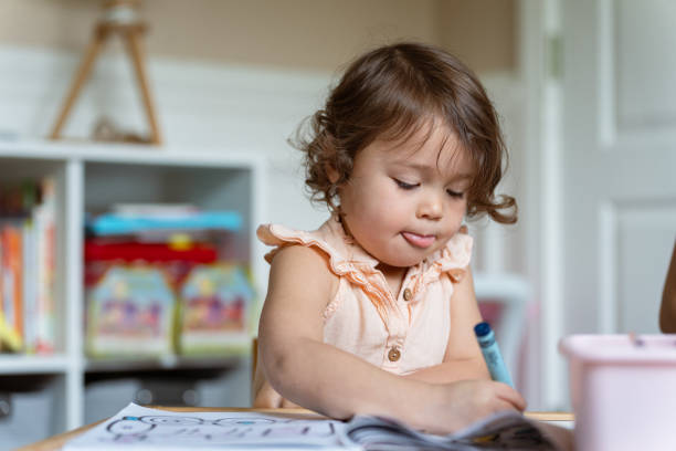 istock Preschool age multiracial girl coloring 1717574561
