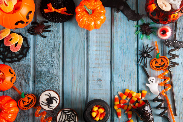 istock Halloween party decorations frame on blue wooden rustic table 1717583644