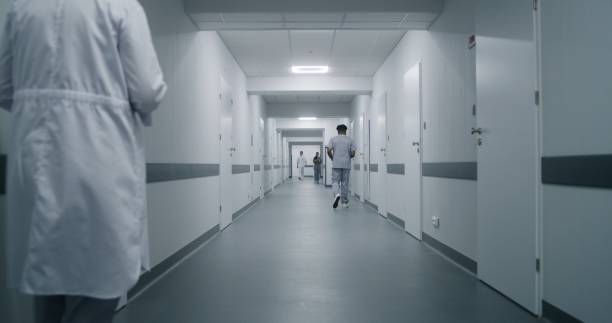 istock Multiracial medical staff walk clinic corridor 1717594316