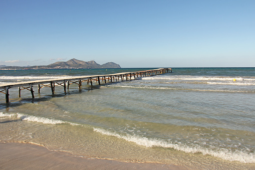 The pontoon of the beach of Muro located at bay Alcudia Majorca Spain