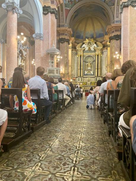 istock praying in church 1717652382