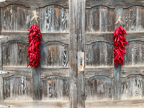 Santa Fe, NM: Red Chili Pepper Ristras, Rustic Gray Doors/Gates