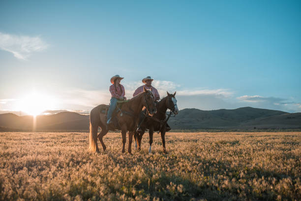 istock Happily Married Couple Riding Horses 1717655822