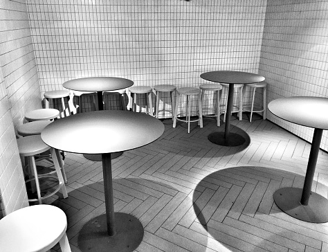 Fast food restaurants, simple small round tables and stools