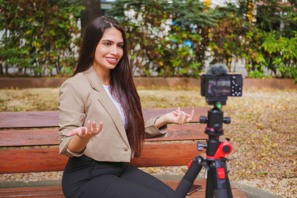 istock beautiful content creator woman making vlog for social media talking to camera 1717714043