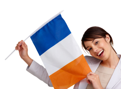 Israel news concept. Female hands holding a round information piece of paper dialog with israel flag isolated over grey studio background