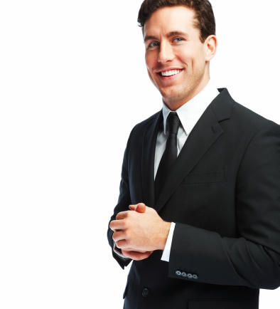 A Caucasian man wearing a suit and posing on a white background