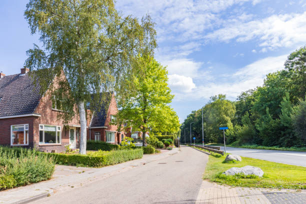 Giethoorn, Netherlands – 30 August 2025: A traditional Dutch house with a thatched roof and colorful flower garden, located along the canal in Giethoorn village. Editorial Use Only. No Property Release.