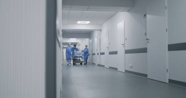 istock Doctors run and push gurney with injured patient 1717750486