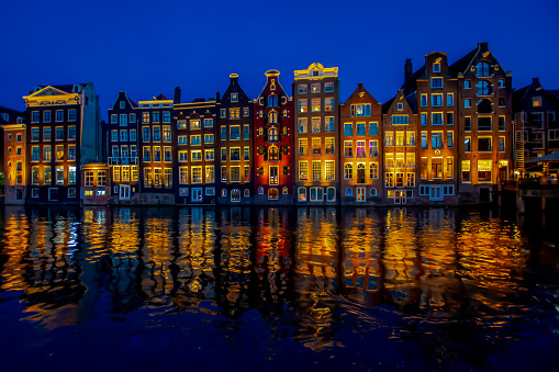 Dancing Canal Houses in Amsterdam reflection on water. Amsterdam, Netherlands