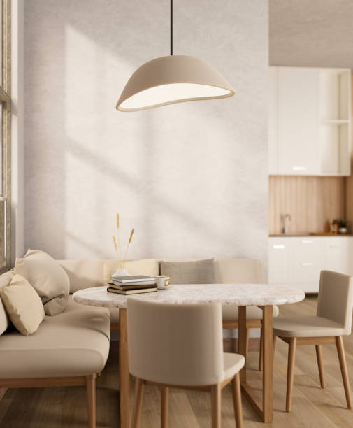 A beautiful minimalist Scandinavian dining area with a dining table, chairs, and a comfy couch.