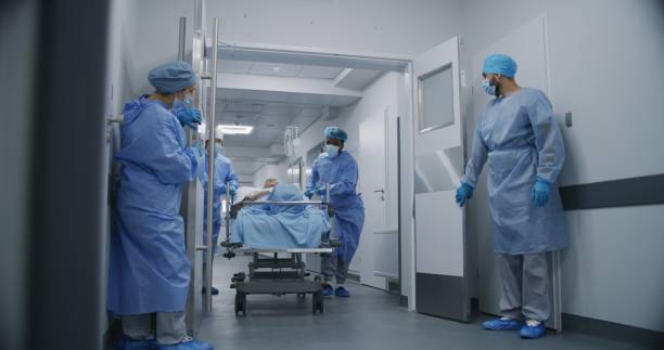 istock Nurse and paramedic open medical facility corridor 1717831086