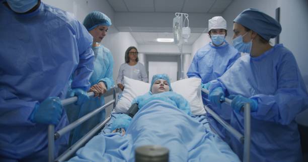 istock Mom supports lying on gurney kid before operation 1717831600