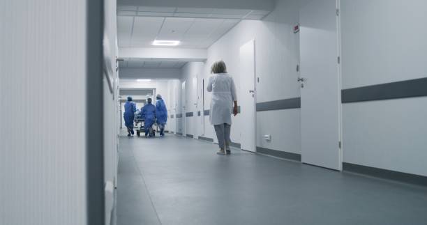 istock Doctors push stretcher with injured patient 1717840542