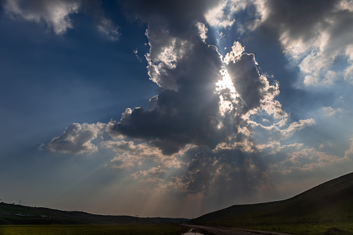 Background heaven with expressive textures of clouds and rays of the sun