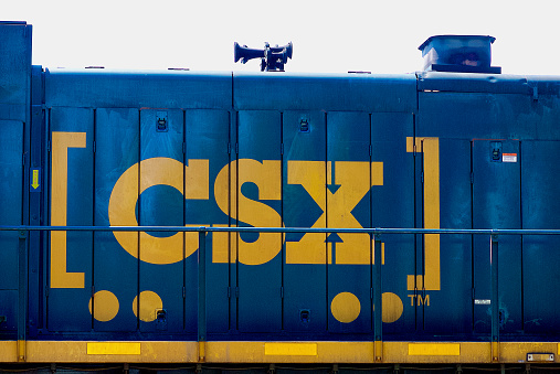 Folkston, Georgia, USA - April 5, 2021: Close-up of a  CSX freight locomotive traveling through the “Folkston Funnel” in southeast Georgia near the Florida state line.