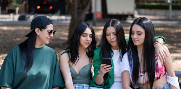 istock four friends in the park 1717842470