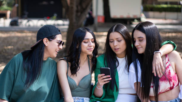 istock four friends in the park 1717842484
