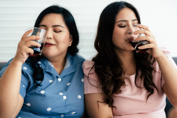 istock Overweight woman drinking soft drink 1717852327