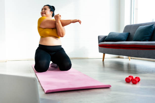 istock Tired large build woman in a plank position 1717861952