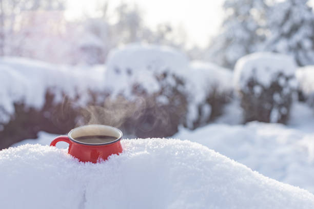 istock Coffee in a cup on the background of a winter theme 1717864652